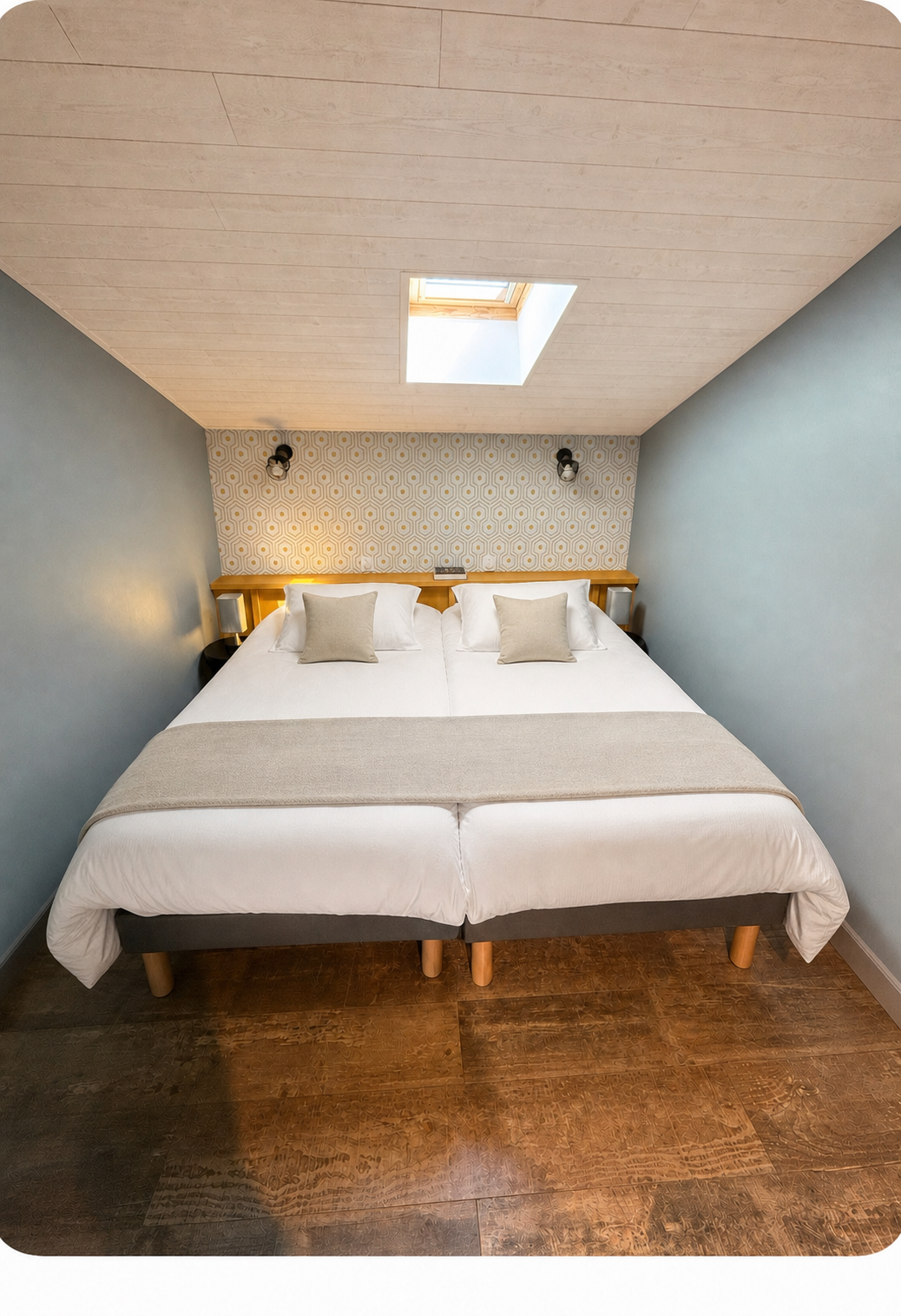 Chambre avec deux lits simples réunissables